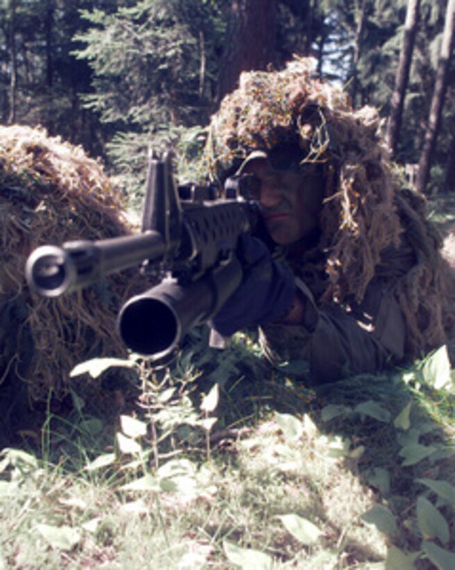Cpl. Simon J. Oram with the 2nd Battalion, 25th Marines, shows his sniping skills at the Multi-National forces during the patrolling phase of lane training. Lane training is a three day event during Baltic Challenge '98, the largest peace support exercise held in the Baltic Region. The United States and 11 European nations will participate in this operation that will be conducted in the spirit of the "Partnership-for-Peace (PFP)" program. 
