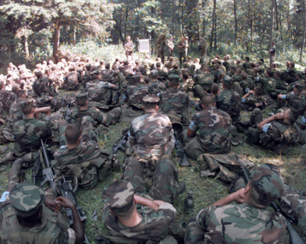 Members from the Multi-National forces receive a class on sniper operations during the patrolling phase of lane training. Lane training is a three day event during Baltic Challenge '98, the largest peace support exercise held in the Baltic Region. The United States and 11 European nations will participate in this operation that will be conducted in the spirit of the "Partnership-for-Peace (PFP)" program. 