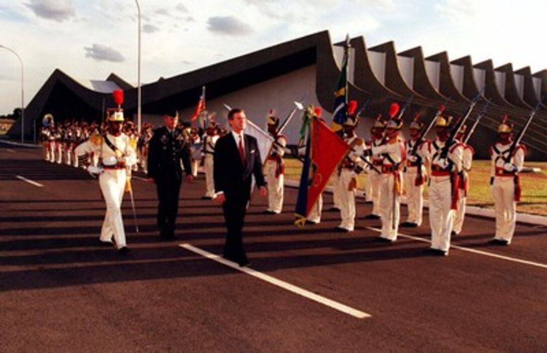 Secretary of Defense William S. Cohen inspects the troops at the Army Headquarters, Brasilia, Brazil, on May 26, 1998. Cohen is meeting with Brazilian defense leaders to strengthen U.S.-Brazilian relationships. 