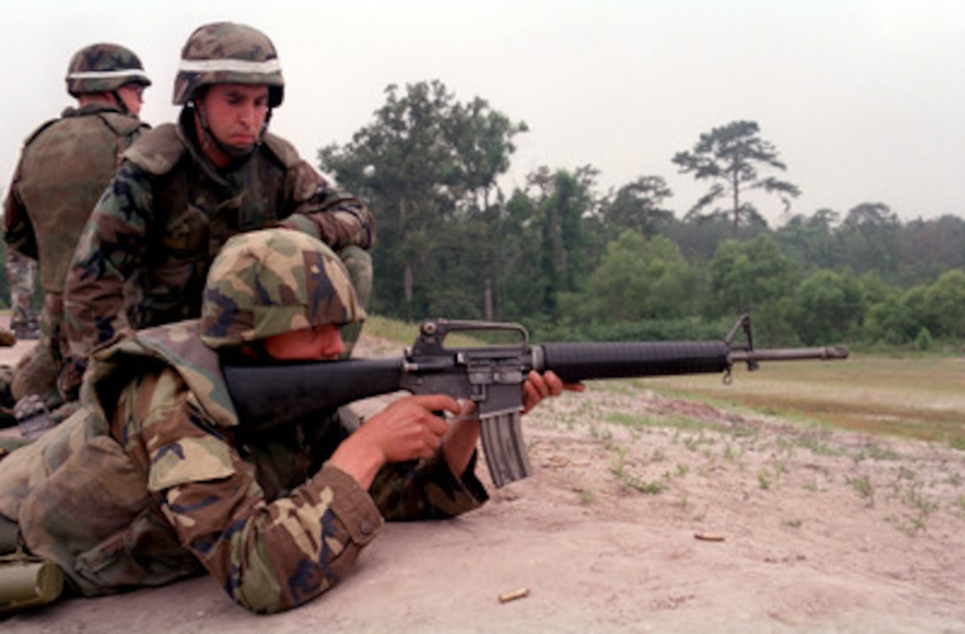 U.S. Marine Cpl. Mark (left) instructs a Latvian soldier on firing an M-16A2 service rifle as part of training during Exercise Cooperative Osprey '98 on June 6, 1998, at Marine Corps Base, Camp Lejeune, N.C. The soldiers are being instructed in the use of basic small arms used by the Marine Corps. Cooperative Osprey '98 is a Partnership for Peace situational training exercise designed to improve the interoperability of NATO and partner nations through the practice of combined peacekeeping and humanitarian relief operations. Partner nations include Albania, Bulgaria, Estonia, Georgia, Kazakstan, Kyrgyzstan, Latvia, Lithuania, Moldova, Poland, Romania, Ukraine, and Uzbekistan. Participating NATO nations include Canada, The Netherlands, and the United States. Mark is attached to the 3rd Battalion, 10th Marine Regiment. 