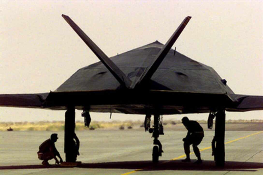 A U.S. Air Force F-117 Nighthawk receives one last check before departing Ahmed Al Jaber Air Base, Kuwait, on June 6, 1998, for redeployment from Operation Southern Watch. Southern Watch is the U.S. and coalition enforcement of the no-fly-zone over Southern Iraq. The Nighthawks were deployed to the Persian Gulf area of operations as part of a force augmentation in Southwest Asia. The stealth fighters are assigned to the 8th Fighter Squadron, 49th Fighter Wing, Holloman Air Force Base, N.M. 