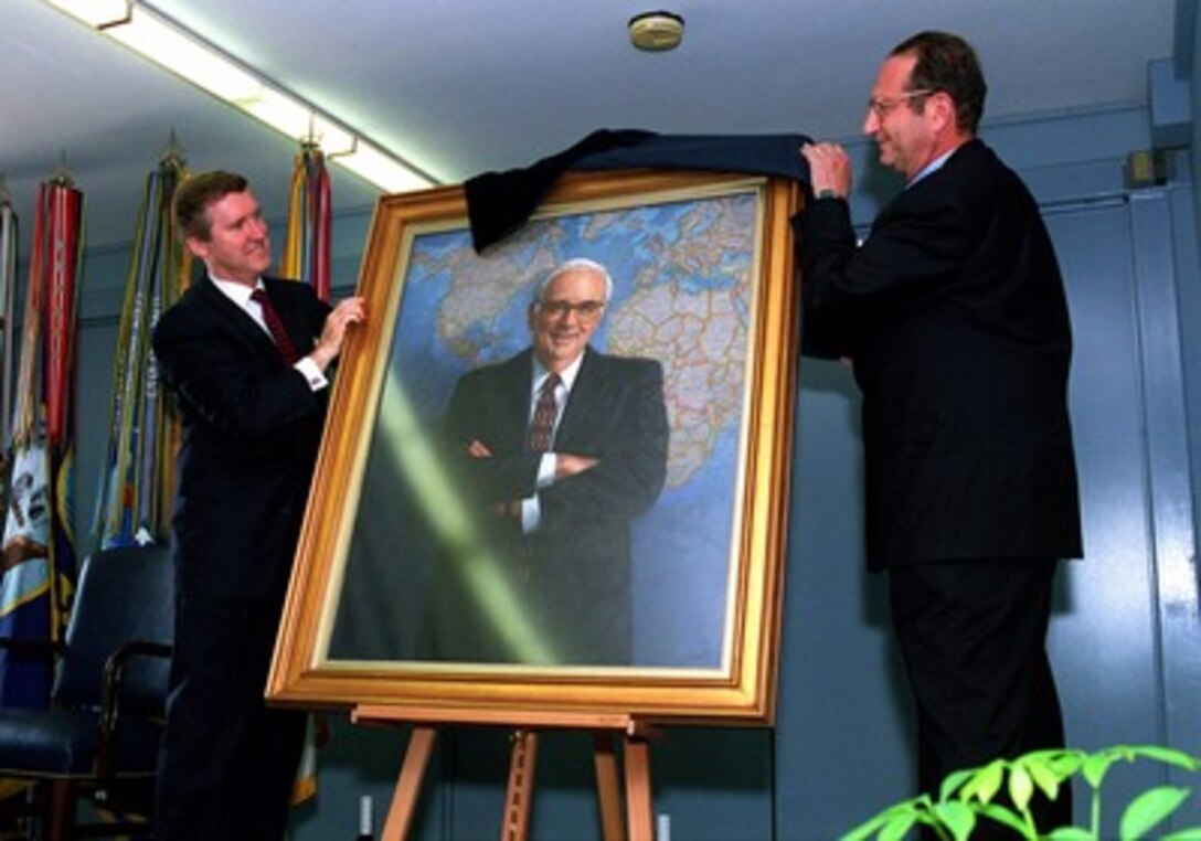 Secretary of Defense William Cohen (left) and former CIA Director John Deutch (right) unveil the portrait of the late Les Aspin during ceremonies at the Pentagon, June 23, 1998. Aspin served as President Clinton's first secretary of defense from Jan. 20, 1993 to Feb. 4, 1994. Mr. Aspin passed away on May 21, 1995. The portrait, by artist John Martin, will be exhibited in a special Pentagon corridor dedicated to the men who have held the office of Secretary of Defense. 