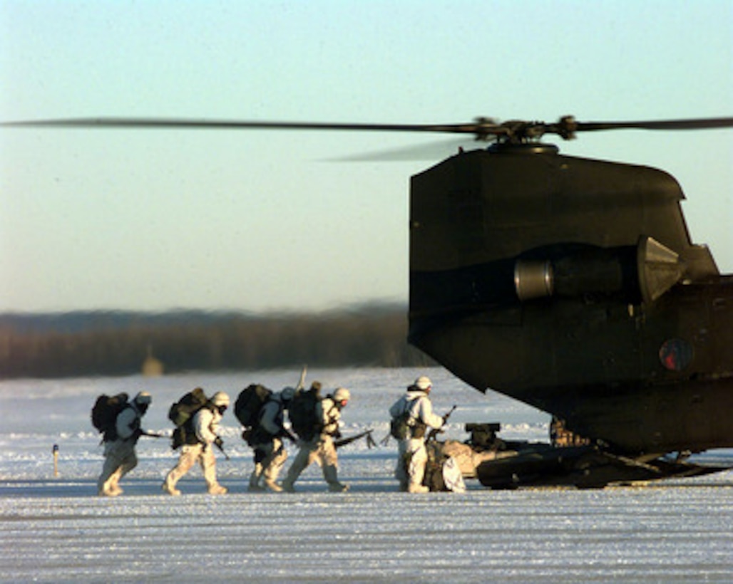 U.S. Army soldiers board a CH-47 Chinook helicopter at Allen Army Airfield, Fort Greeley, Alaska, on Feb. 23, 1998, during Exercise Northern Edge 98. More than 90,000 soldiers, sailors, Marines, airmen Coast Guardsmen and National Guardsmen are participating the exercise. Northern Edge 98 is designed to practice joint operational techniques and procedures, increasing interoperability between the services. 
