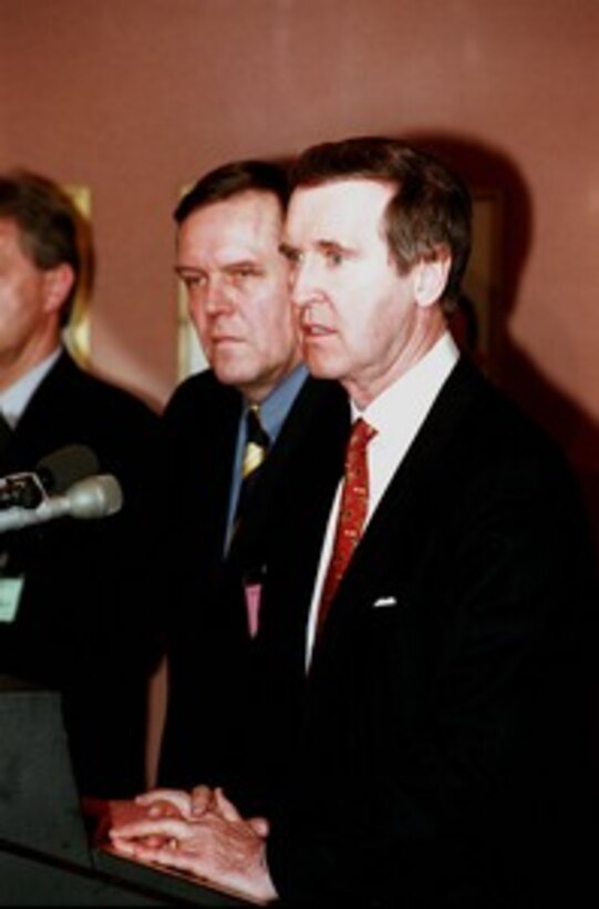 Secretary of Defense William S. Cohen (right) listens to a reporter's question during a joint press conference with German Minister of Defense Volker Ruehe (left) in Munich, Germany on Feb. 7, 1998, during the Werkunde Conference. The ministers' press conference followed the signing of the Follow-on Implementing Amendment to the 1983 Agreement on Cooperative Measures for Enhancing Air Defense for Central Europe. The agreement permits the transfer of title of 21 U.S.-owned and German manned Roland weapon systems and 12 Patriot fire units to the Germans. 