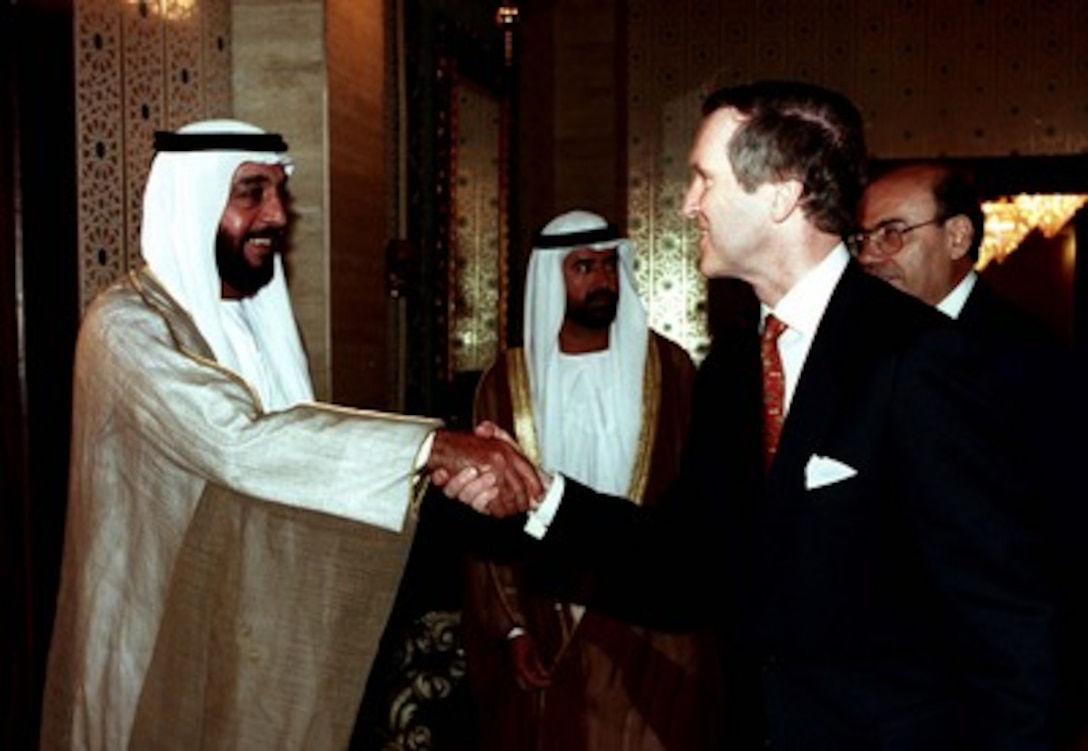 His Highness Crown Prince Sheikh Khalifa Bin Zayed Al Nahyan (left), deputy supreme commander of the United Arab Emirates, welcomes Secretary of Defense William S. Cohen (right) to his palace on Feb. 10, 1998. 