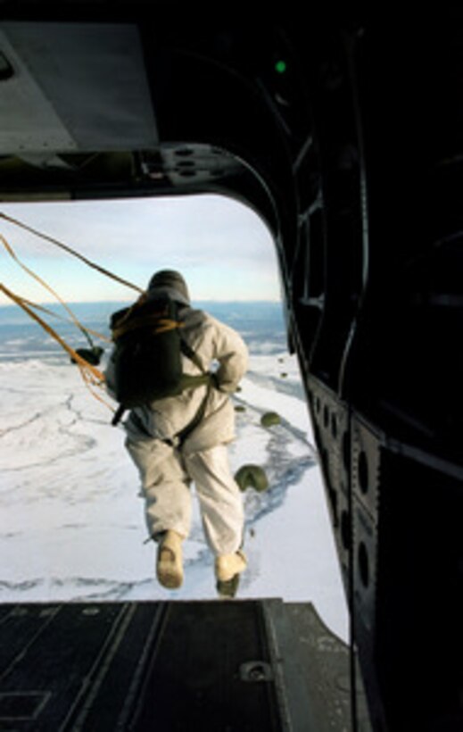 Command Sgt. Maj. Carlos Paga jumps from a CH-47D Chinook helicopter for an air assault on the fictional town of Simpsonville in the Yukon Training Area west of Fort Greely, Alaska, during Exercise Northern Edge 98, on Feb. 20, 1998. More than 90,000 soldiers, sailors, Marines, airmen, Coast Guardsmen and National Guardsmen are participating the exercise. Northern Edge 98 is designed to practice joint operational techniques and procedures, increasing interoperability between the services. Paga is the command sergeant major for the 1st Battalion, 6th Infantry Division (L), Fort Greely, Alaska. 
