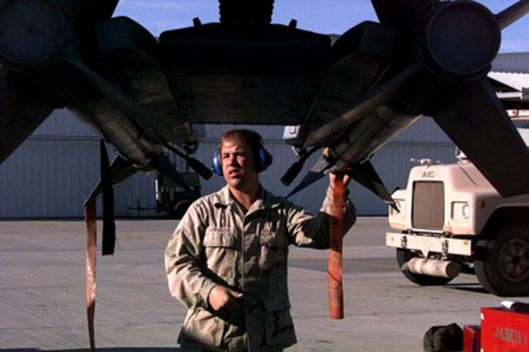 Airman 1st Class Brian Swanson secures two AIM-9 air-to-air missiles on an A-10 Thunderbolt after the aircraft returns from patrolling the no-fly-zone over Southern Iraq on Feb. 27, 1998, in support of Operation Southern Watch. Swanson is an aircraft armament systems apprentice assigned to the 74th Fighter Squadron deployed from the 23rd Fighter Group, Pope Air Force Base, N.C. The A-10's of the 74th have been flying the zone since 1994 in support of Southern Watch. 