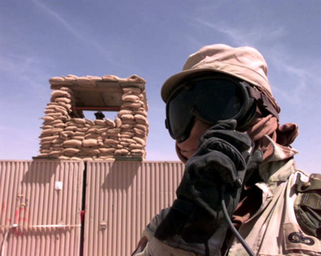 Members of the U.S. Air Force 305th Air Expeditionary Group use goggles and other protective clothing to help them deal with the 35 knot winds at an operating base in Southwest Asia on March 3, 1998. The month of March marks the beginning of the windy season in the Persian Gulf region which will last well into late August. The 305th Air Expeditionary Group is currently operating as part of an Air Mobility Command Tanker Task Force operating in the Southwest Asia theater in support of Operation Southern Watch. Southern Watch is the U.S. and coalition enforcement of the no-fly-zone over Southern Iraq. 