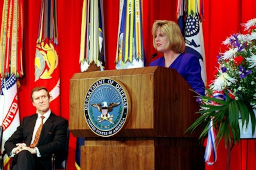 Tipper Gore, wife of Vice President Al Gore, delivers the keynote address at the Pentagon observance of National Women's History Month on March 5, 1998. Secretary of Defense William Cohen (left) is the host for the event in the Pentagon auditorium. 