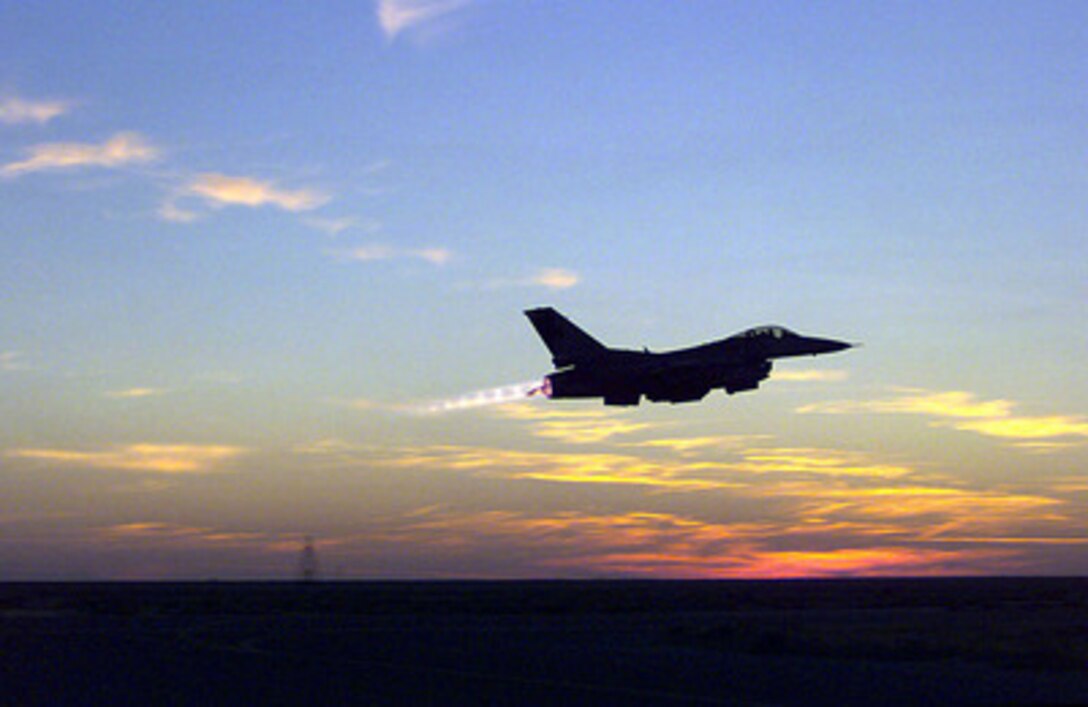 A U.S. Air Force F-16 Fighting Falcon hits the afterburner as it takes off from Al Jaber Air Base, Kuwait, on March 11, 1998. Fighting Falcons have been deployed to Kuwait in support of Operation Southern Watch, which is the U.S. and coalition enforcement of the no-fly-zone over Southern Iraq. The F-16 is deployed from the 114th Fighter Wing, Sioux Falls, South Dakota Air National Guard. 