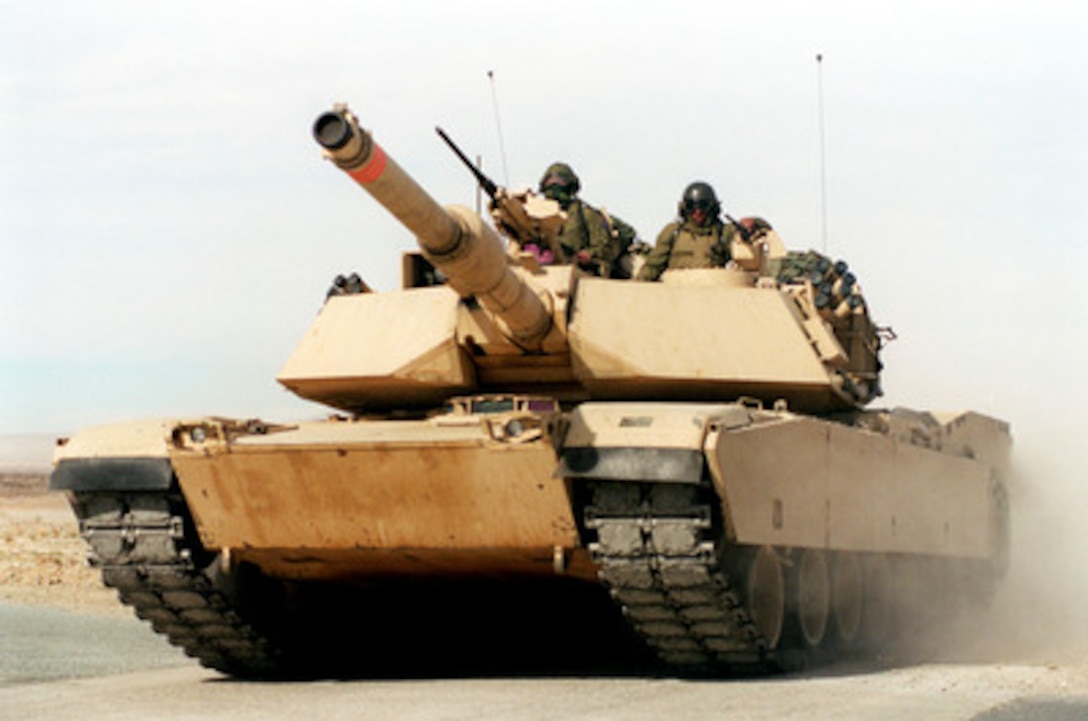A U.S. Marine Corps M-1A1 Abrams main battle tank races across the desert at the Marine Corps Air Ground Combat Center, Twentynine Palms, Calif., on Jan. 27, 1998. These tankers from the 2nd Tank Battalion are taking part in Combined Arms Exercise 3-98. 