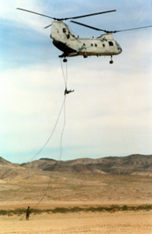 Marines from the 2nd Reconnaissance Battalion repel from a CH-46E Sea Knight helicopter to the desert floor of the Marine Corps Air Ground Combat Center, Twentynine Palms, Calif., on Feb. 12, 1998. The Marines are practicing different insertion techniques as part of Combined Arms Exercise 4-98. 
