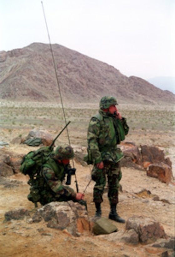 Marines from Communications Company, Headquarters Battalion provide command and control via radio at Range 400 of the Marine Corps Air Ground Combat Center, Twentynine Palms, Calif., on Feb. 13, 1998. These Marines are taking part in Combined Arms Exercise 4-98. 