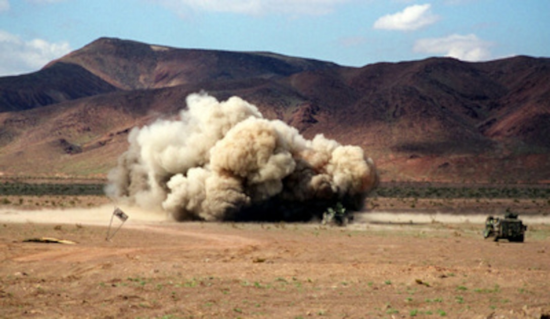 U.S. Marines from the 2nd Combat Engineer Battalion explode a line charge in a simulated breach of a mine field at the Marine Corps Air Ground Combat Center, Twentynine Palms, Calif., on Feb. 27, 1998. The Marines are taking part in Combined Arms Exercise 4-98. 