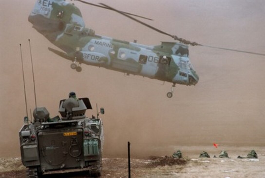 A U.S. Marine CH-46 Sea Knight helicopter from the 26th Marine Expeditionary Unit lifts off after unloading Marines at the live fire range at Glamoc, Bosnia and Herzegovina, on April 2, 1998. Assigned to the Strategic Reserve Force of the Stabilization Force, the Marines are taking part in Exercise Dynamic Response 98, a training exercise designed to familiarize the reserve forces with the territory and their operational capabilities within this region. 