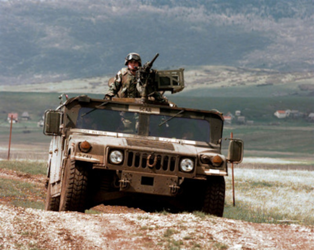 A U.S. Army scout team maneuvers their Humvee on the live fire range at Glamoc, Bosnia and Herzegovina, on May 6, 1998. These 2nd Armored Cavalry Regiment soldiers are deployed to Bosnia and Herzegovina as part of the Stabilization Force in Operation Joint Guard. 