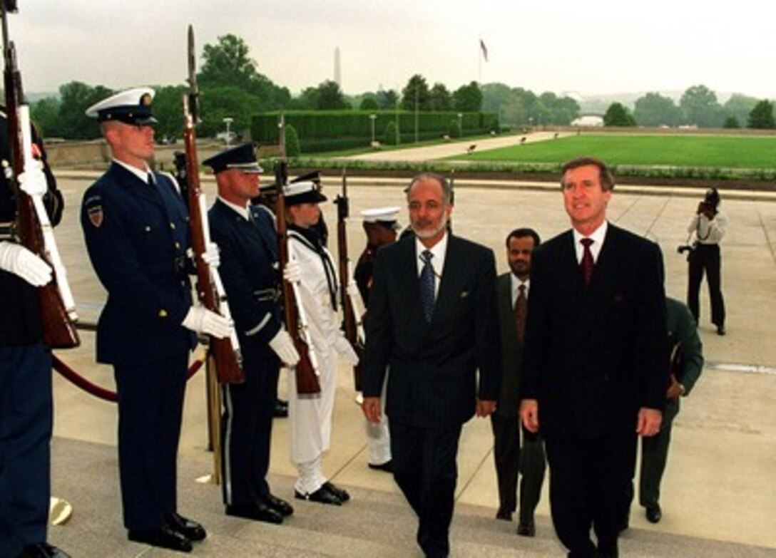 Secretary of Defense William S. Cohen (right) escorts Minister Responsible for Foreign Affairs Yusuf bin Alawi bin Abdallah (left) of the Sultanate of Oman into the Pentagon on May 6, 1998. 