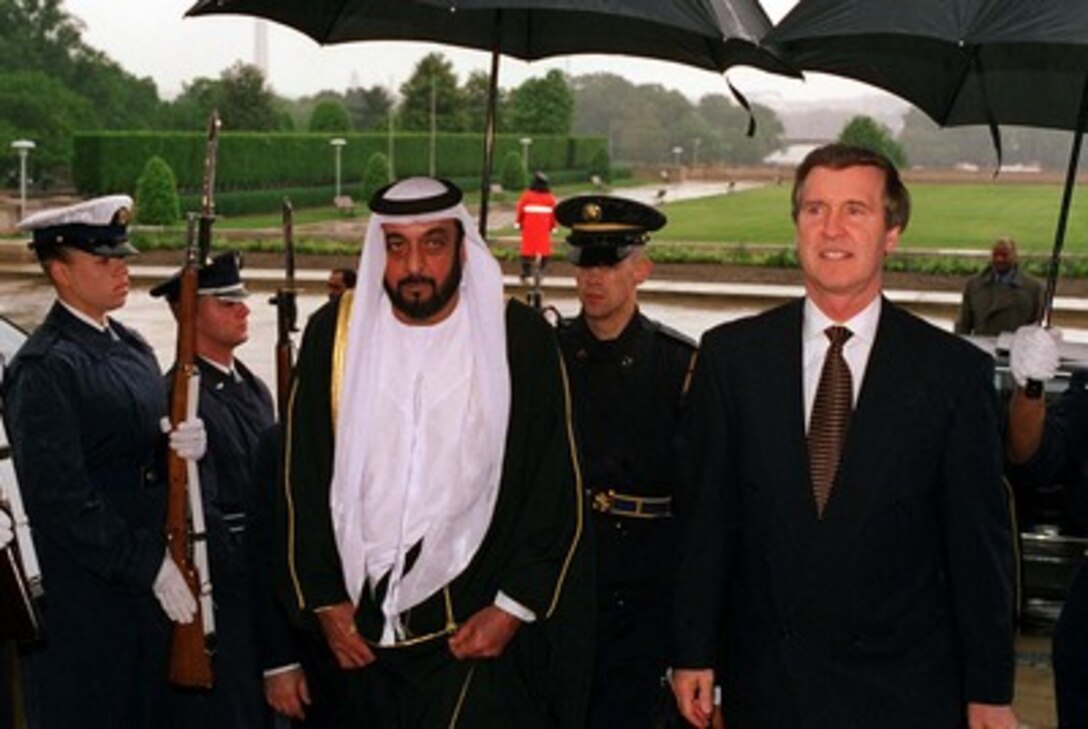 Secretary of Defense William S. Cohen (right) escorts Crown Prince and Deputy Supreme Commander Abu Dhabi, United Arab Emirates, Sheikh Khalifa Bin Zayed Al Nahyan (left) into the Pentagon on May 12, 1998. 