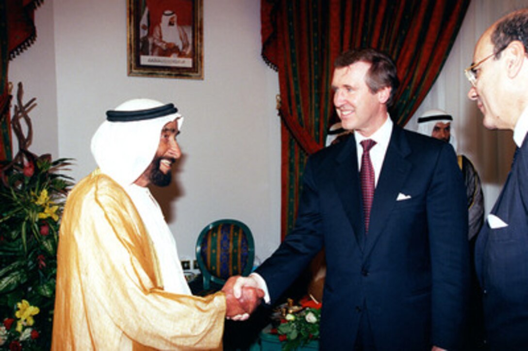 President His Highness Sheikh Zayed Bin Sultan Al Nuhayyan (left) welcomes Secretary of Defense William S. Cohen (right) to the United Arab Emirates on Oct. 11, 1998. Cohen is in the Persian Gulf region to visit with U.S. troops and heads of state in the Gulf countries. 
