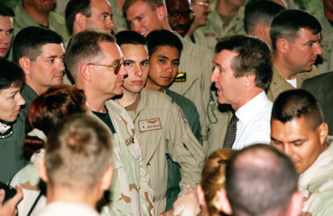 Secretary of Defense William S. Cohen mingles among the crowd of U.S. forces at Prince Sultan Air Base, Saudi Arabia, on Oct. 14, 1998. Personnel took the opportunity to ask questions and have their photograph taken with the defense secretary. Cohen is in the Persian Gulf region to visit with U.S. troops and heads of state in the Gulf countries. 