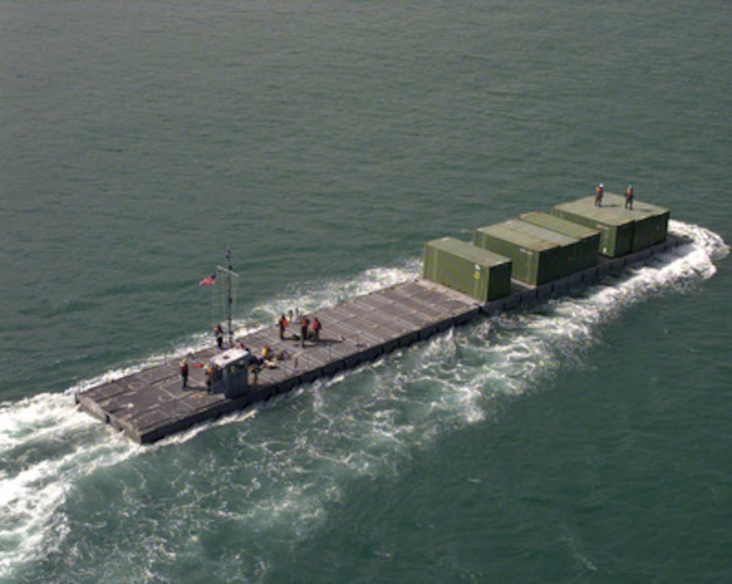 A U.S. Army Modular Causeway System transports containers of Army equipment from the USNS Pollux to a pier in the harbor of Pusan, Republic of Korea, on Oct. 19, 1998, for Exercise Foal Eagle '98. Foal Eagle '98 is a combined, joint exercise supported by forces from the U.S. and Republic of Korea. In addition to providing hands-on field experience for forces of both nations, Foal Eagle '98 was designed to test rear area protection operations and major command, control and communications systems. Pollux is one of eight Fast Sealift Ships belonging to the Military Sealift Command that have special features allowing them to load and off-load cargo in places lacking normal port facilities. Causeway systems are deployable aboard container ships and other cargo vessels as the Pollux. 