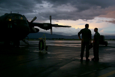 PhotosTwo Air National Guardsmen wait as their W. Va. Air National Guard C-130 Hercules is refueled.
