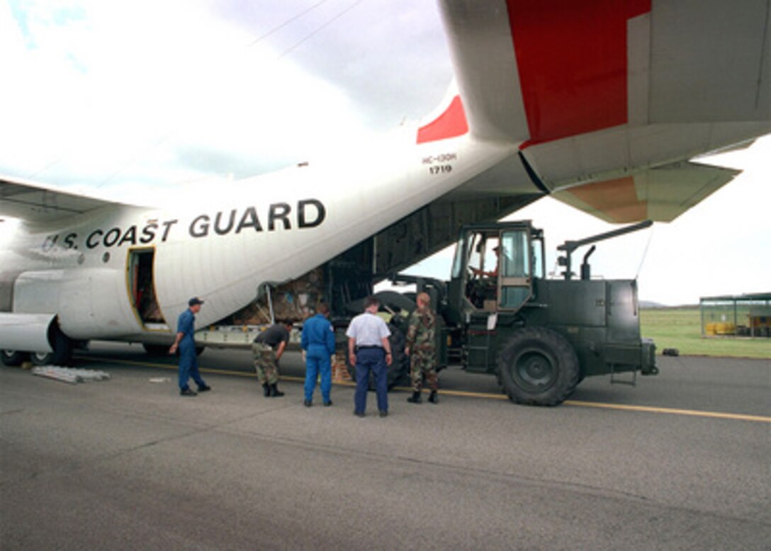 Water and medical supplies destined for the Dominican Republic as part of Hurricane Georges relief efforts are loaded on a U.S. Coast Guard C-130 Hercules at Naval Station Roosevelt Roads, Puerto Rico, on Sept. 29, 1998. The water and medical supplies are a small part of the Federal Emergency Management Agency requests for delivery of more than 8,500 tons of hurricane relief supplies and aid in the Caribbean. The Hercules is deployed from Coast Guard Air Station Clearwater, Fla. 