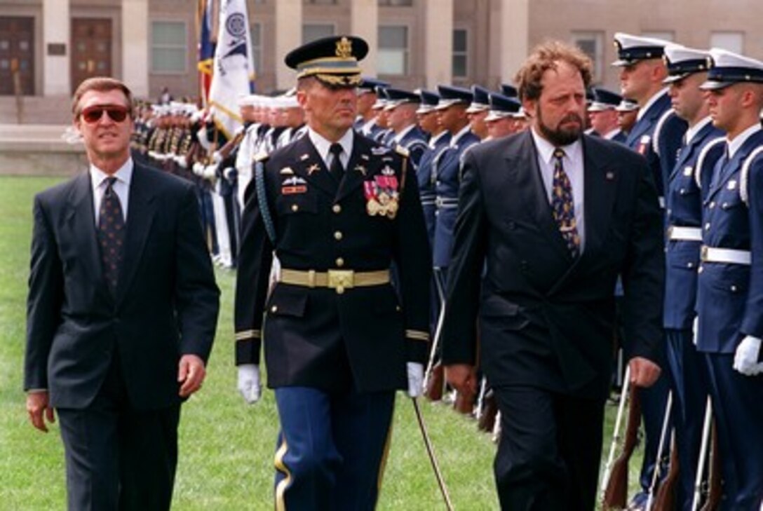 Secretary of Defense William S. Cohen (left) and Commander of Troops Col. Gregory Gardner, U.S. Army, (center) accompany Minister of Defense Vladimir Vetchy (right), of the Czech Republic, as he inspects the joint services honor guard at the Pentagon on Sept. 18, 1998. Vetchy will meet with Cohen and other senior Department of Defense officials to discuss a range of security issues. 