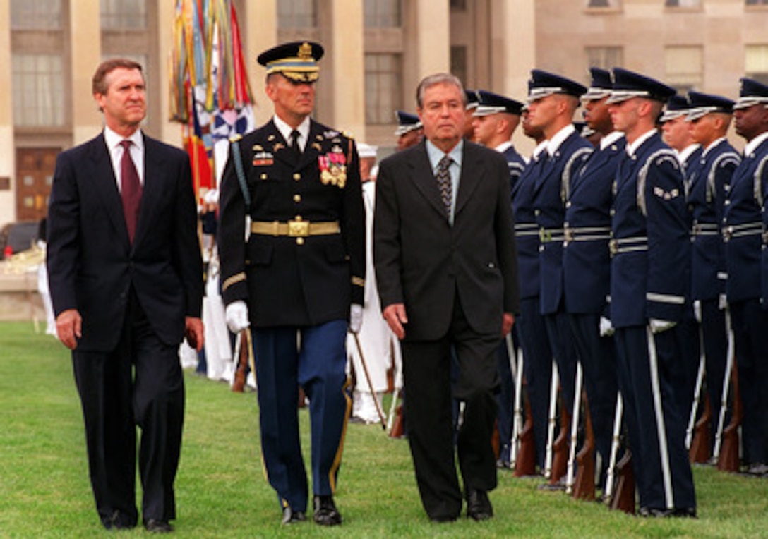 Secretary Cohen escorts Minister of Defense Guzman as he inspects the honor  guard.