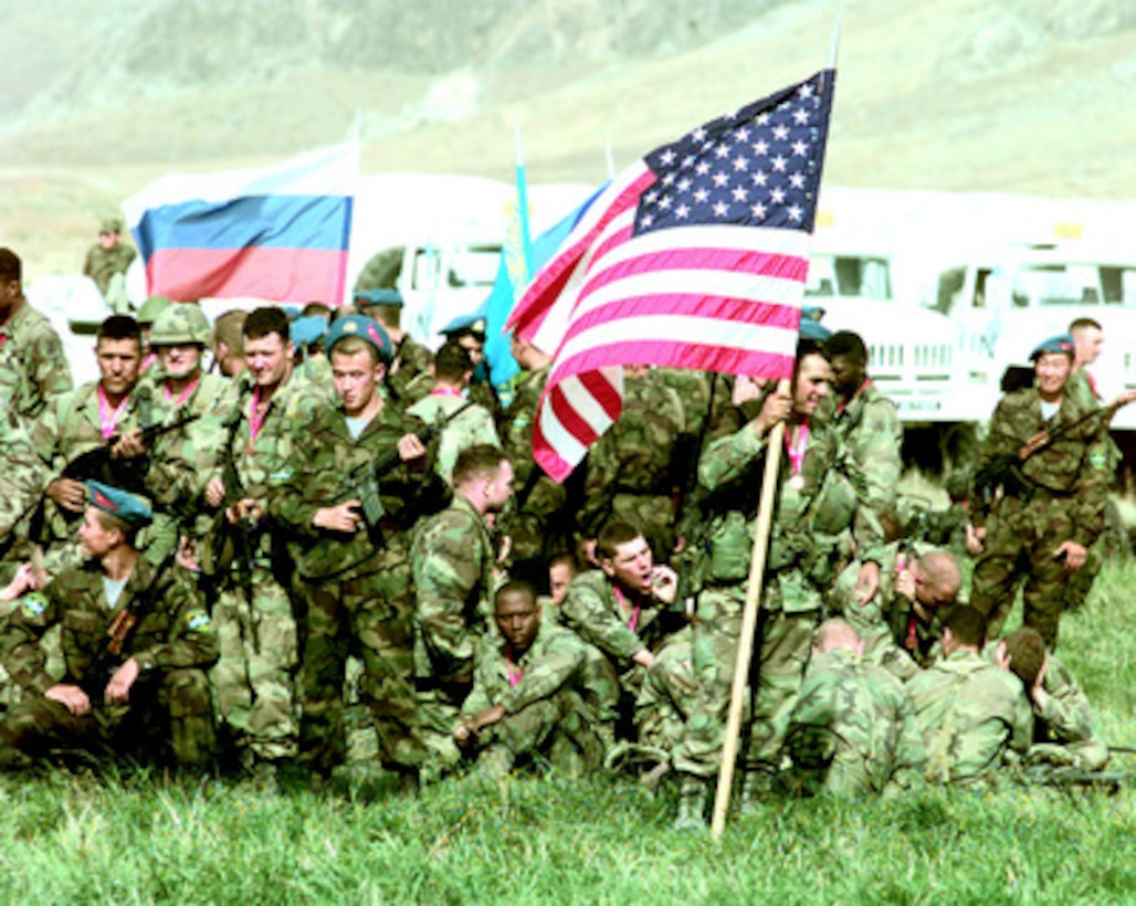 Soldiers from the U.S. Army's 10th Mountain Division, Fort Drum, N.Y., intermingle with their foreign counterparts prior to the closing ceremony for Exercise CENTRAZBAT '98, in Osh, Kyrgyzstan, on Sept. 28, 1998. Exercise CENTRAZBAT '98 involves more than 450 military personnel from Azerbaijan, Georgia, Kazakhstan, Kyrgyzstan, Russia, Turkey, and Uzbekistan who are training with over 250 U.S. military troops to hone their peacekeeping skills. The exercise is designed to enhance regional cooperation and increase interoperability training among NATO and Partnership for Peace nations. 