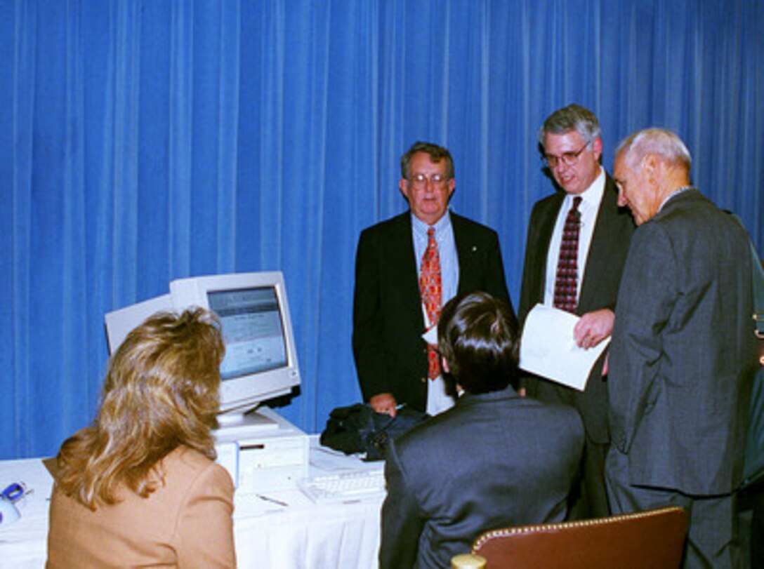 Deputy Secretary of Defense John J. Hamre briefs reporters on the accomplishments of the Defense Reform Initiatives in the Pentagon on Oct. 8, 1998. 