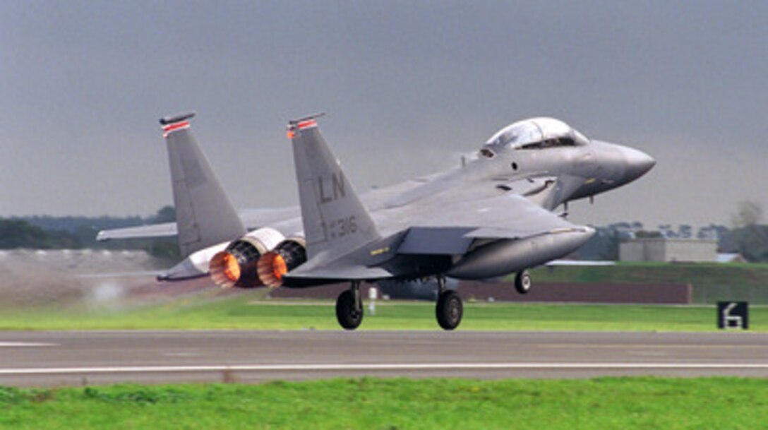 With its afterburners glowing, a U.S. Air Force F-15E Eagle lifts off from the runway at R.A.F. Mildenhall, England, on Oct. 1, 1998. The Eagle is deploying to a forward location as part of the four air expeditionary wings the U.S. Air Force has formed in support of possible NATO contingency operations in Kosovo. The F-15 Eagle is an all-weather, extremely maneuverable, tactical fighter designed to gain and maintain air superiority in aerial combat. The aircraft belongs to the 494th Fighter Squadron, R.A.F. Lakenheath, England. 
