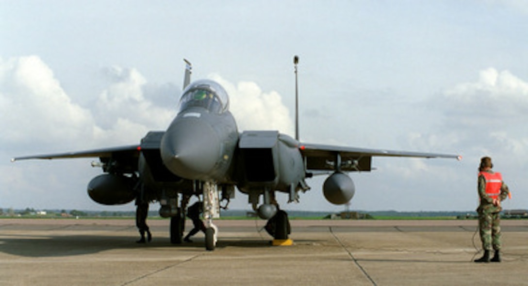 A U.S. Air Force F-15E Eagle is given a final check before proceeding to the runway for takeoff at R.A.F. Mildenhall, England, on Oct. 1, 1998. The Eagle is deploying to a forward location as part of the four air expeditionary wings the U.S. Air Force has formed in support of possible NATO contingency operations in Kosovo. The F-15 Eagle is an all-weather, extremely maneuverable, tactical fighter designed to gain and maintain air superiority in aerial combat. The aircraft belongs to the 492nd Fighter Squadron, R.A.F. Lakenheath, England. 