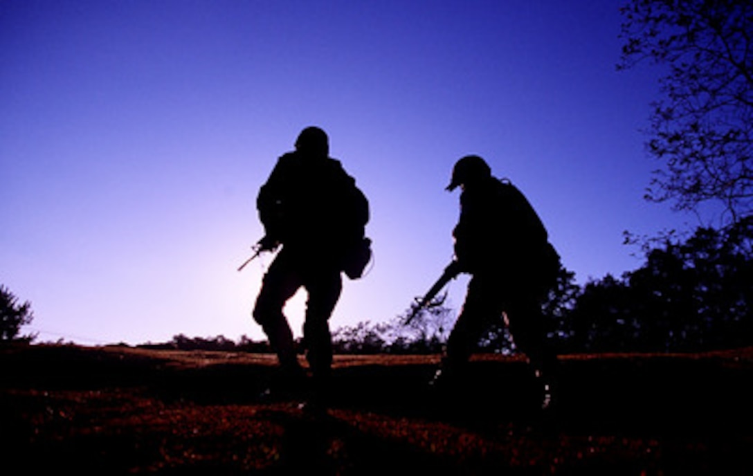 Soldiers of the Joint Security Area Scout Platoon return from a patrol of the Demilitarized Zone in the Republic of Korea, on Oct. 20, 1998. The patrol is part of a Quick Reaction Force that is positioned in the zone to respond to any situations that may arise. These U.S. Army soldiers are assigned to the United Nations Command Security Battalion. 