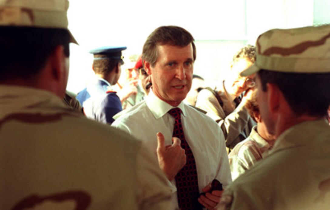 Secretary of Defense William S. Cohen speaks with U.S. Army soldiers at Army Central Command in Qatar, on Oct. 10, 1998. Cohen is in the Persian Gulf region to visit with U.S. troops and heads of state in the Gulf countries. 