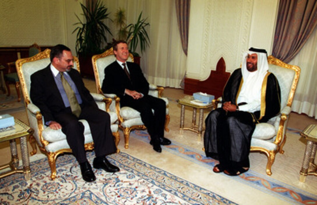 U.S. Ambassador to Qatar Patrick N. Theros (left) accompanies Secretary of Defense William S. Cohen (center) during a visit with the Minister of Foreign Affairs His Excellency Sheikh Hamad bin Jasim Al-Thani (right) at the Emiri Diwan, Doha, on Oct. 10, 1998. Cohen is in the Persian Gulf region to visit with U.S. troops and heads of state in the Gulf countries. 