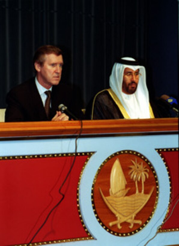 Secretary of Defense William S. Cohen (left), and Minister of Foreign Affairs His Excellency Sheikh Hamad bin Jasim Al-Thani (right), conduct a joint press briefing at the Emir Diwan, Doha, Qatar, on Oct. 10, 1998. Cohen is in the Persian Gulf region to visit with U.S. troops and heads of state in the Gulf countries. 