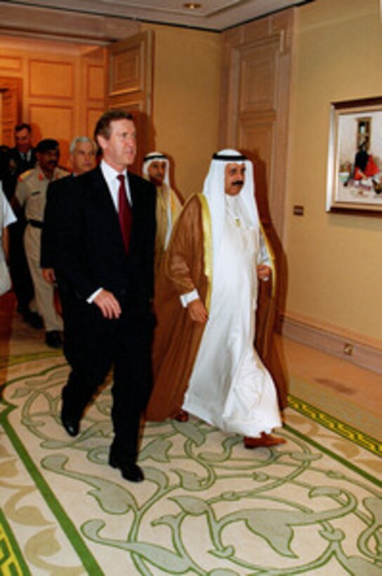 Secretary of Defense William S. Cohen (left) and Minister of Defense Shaykh Salem Al-Sabah Al-Salem Al-Sabah (right) walk to their meeting at Kuwait International Airport on Oct. 12, 1998. Cohen is in the Persian Gulf region to visit with U.S. troops and heads of state in the Gulf countries. 