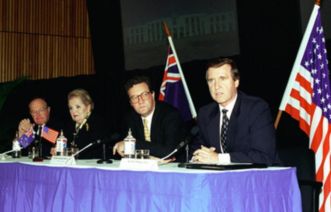 Secretary of Defense William S. Cohen (right) makes an opening statement during a joint press conference at the conclusion of the annual Australia-United States Ministerial Consultations in Sydney, Australia, on July 31, 1998. The release of the joint communiqué and announcement of a joint security declaration was presented at HMAS Watson, Sydney, Australia by the attending leaders, from left to right: Australian Minister of Defense Ian McLachlan, United States Secretary of State Madeleine Albright, Australian Minister for Foreign Affairs Alexander Downer, and Cohen. 