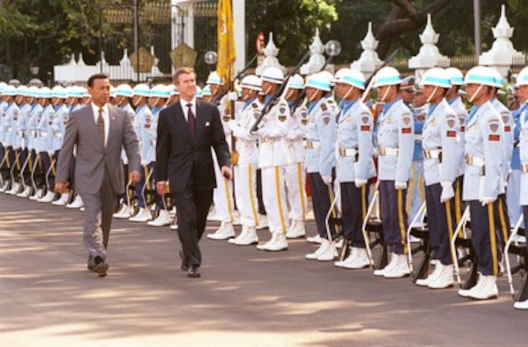 Minister of Defense General Wiranto (left) escorts Secretary of Defense William S. Cohen (right) as he inspects the troops during an armed forces full honors ceremony welcoming Cohen to Jakarta, Indonesia, on Aug. 1, 1998. 
