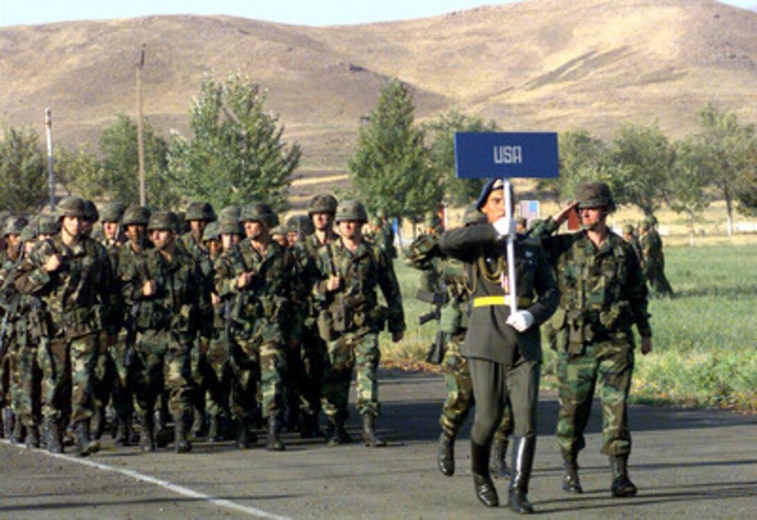 Soldiers from the U.S. Army's 10th Mountain Division, Fort Drum, N.Y., march past the reviewing stand in Chirchik, Uzbekistan, during the opening day ceremonies for Exercise CENTRAZBAT '98 on Sept. 22, 1998. Exercise CENTRAZBAT '98 involves more than 450 military personnel from Azerbaijan, Georgia, Kazakhstan, Kyrgyzstan, Russia, Turkey, and Uzbekistan who are training with over 250 U.S. military troops to hone their peacekeeping skills. The exercise will enhance regional cooperation and increase interoperability training among NATO and Partnership for Peace nations. The exercise is being held in Chirchik and Osh, Kyrgyzstan. 