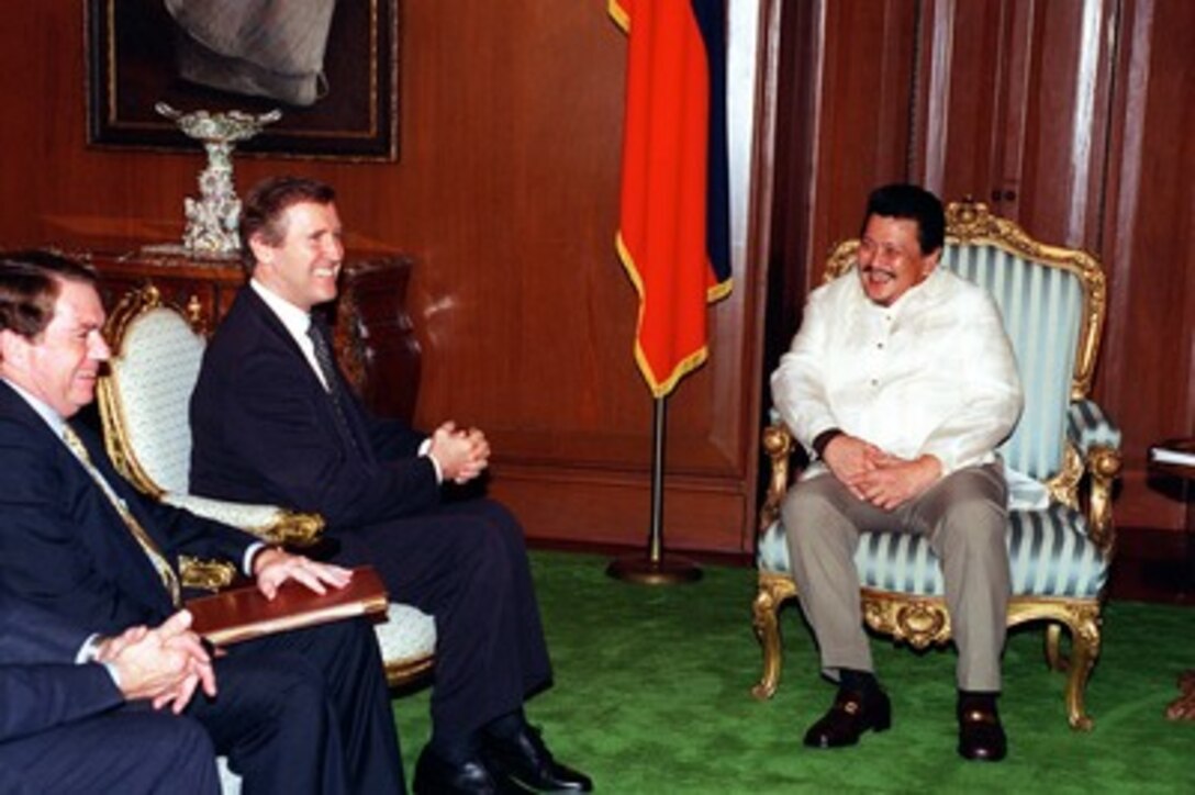 U.S. Ambassador to the Republic of the Philippines Thomas Hubbard (left) and Secretary of Defense William S. Cohen (center) visit with President Joseph E. Estrada (right) at Malacanang Palace, Philippines, on Aug. 3, 1998. Cohen is in the Philippines to discuss a pending agreement on the resumption of military exercises between the Philippines and the United States. 