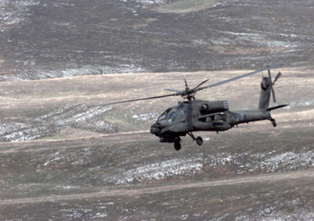 An AH-64 Apache flies to its firing position at the Glamoc Firing Range, Bosnia and Herzegovina, on Sept. 2, 1998. Helicopters from the U.S. Army's 6th Squadron, 6th U.S. Cavalry, 11th Aviation Regiment are conducting a live fire exercise using 2.75 inch rockets, Hellfire missiles and 30 mm ammunition. The helicopters are deployed to Bosnia and Herzegovina in support of Operation Joint Forge. 