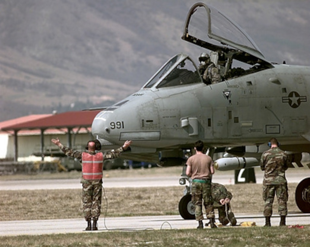 Members of the 81st Fighter Squadron perform safety checks on an A-10 Thunderbolt II at Aviano Air Base, Italy, after its return from flying air strike missions in support of NATO Operation Allied Force on March 31, 1999. Operation Allied Force is the air operation against targets in the Federal Republic of Yugoslavia. Members of the 81st are deployed to Aviano from Spangdahlem Air Base, Germany, in support of Allied Force. 