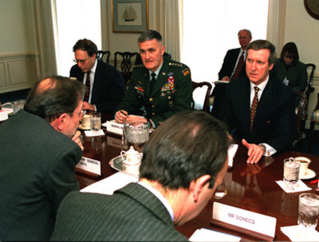 NATO Secretary General Javier Solana (left) meets with Secretary of Defense William Cohen (right) the Pentagon on March 15, 1999. Under discussion was the appropriate NATO reaction should the government of the Federal Republic of Yugoslavia refuse to sign the peace agreement being worked out in Rambouillet, France, with the Kosovar Albanians. Among those representing DoD at the meeting were U.S. Ambassador to NATO Sandy Vershbow (2nd from left) and Chairman of the Joint Chiefs of Staff Gen. Henry H. Shelton, U.S. Army (3rd from left). 