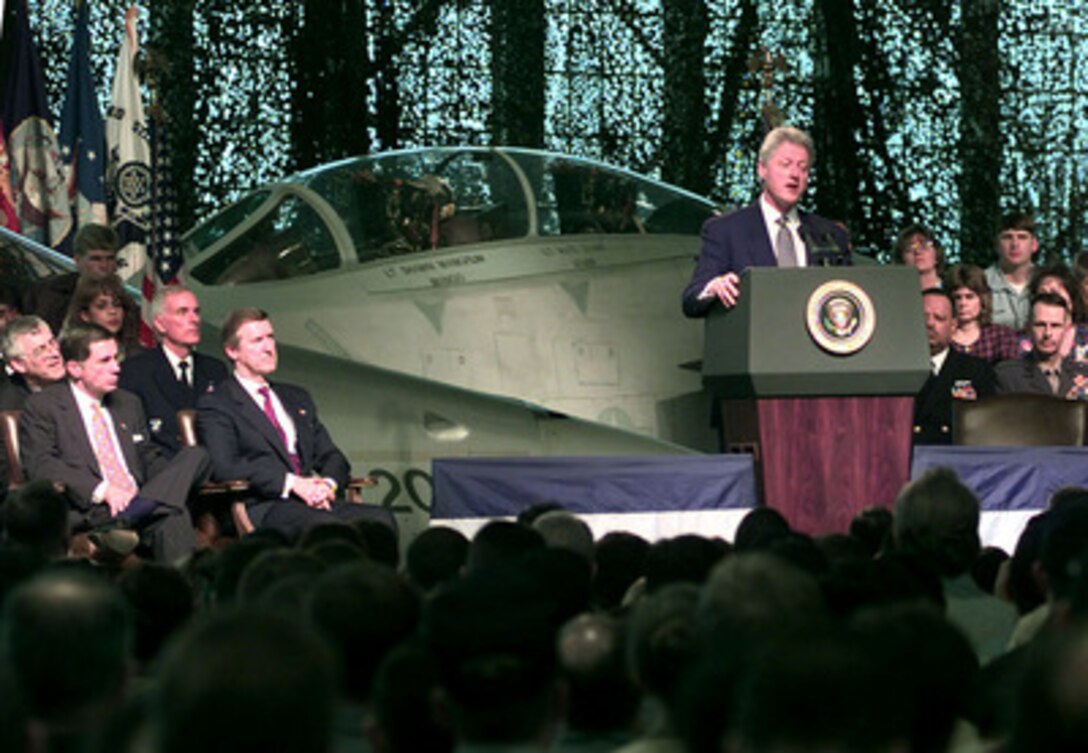 President Clinton addresses U.S. and NATO military personnel, families, and civilian Department of Defense employees at Norfolk Naval Station, Va., on April 1, 1999. The President expressed America's thanks to personnel deployed overseas in support of U.S. and NATO operations, as well as underscore the importance of NATO Operation Allied Force in the Former Republic of Yugoslavia. Joining Clinton on the dais are from left to right are: Secretary of the Navy Richard Danzig, Sen. Charles Robb R-Va., Adm. Harold W. Gehman Jr. and Secretary of Defense William S. Cohen. 