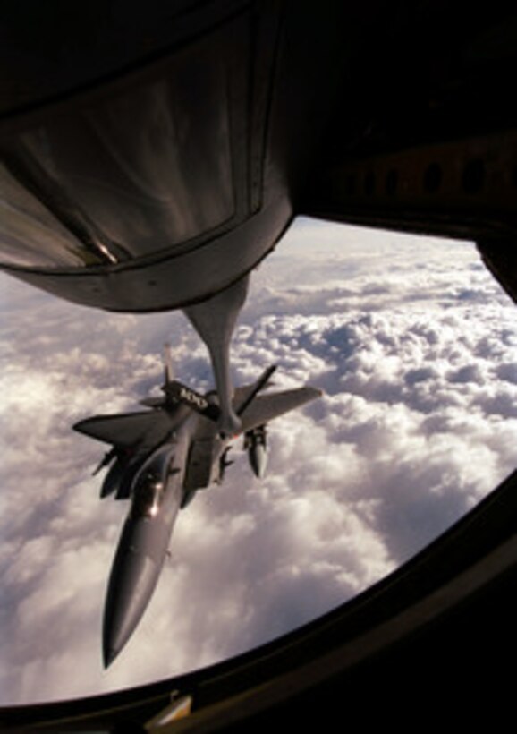 A U.S. Air Force F-15C Eagle is framed by the boom operator's window as it approaches a KC-135R Stratotanker for in-flight refueling during NATO Operation Allied Force on March 31, 1999. Operation Allied Force is the air operation against targets in the Federal Republic of Yugoslavia. The Eagle is armed with AIM-7 Sparrow air-to-air missiles, AIM-120C Advanced Medium Range Air-to-Air Missiles and AIM-9 Sidewinder heat seeking missiles. The Eagle is attached to the 48th Fighter Wing, RAF Lakenheath, United Kingdom. The Stratotanker is from the 351st Air Refueling Squadron based at RAF Mildenhall, United Kingdom, with the 100th Air Expeditionary Wing. 