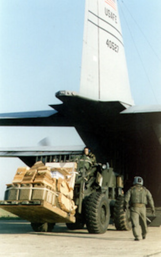 U.S. Air Force personnel from the 86th Contingency Response Group unload relief supplies from the rear of a C-130 Hercules cargo plane on April 1, 1999, at the Tirana, Albania, airport in support of Operation Sustain Hope. Operation Sustain Hope is the U.S. humanitarian effort to bring in food, water, medicine and relief supplies for the refugees fleeing from the Former Republic of Yugoslavia into Albania and Macedonia. Members of the 86th are deployed to Albania from Ramstein Air Base, Germany, to assist with relief operations. The Hercules is attached to the 86th Airlift Wing at Ramstein. 