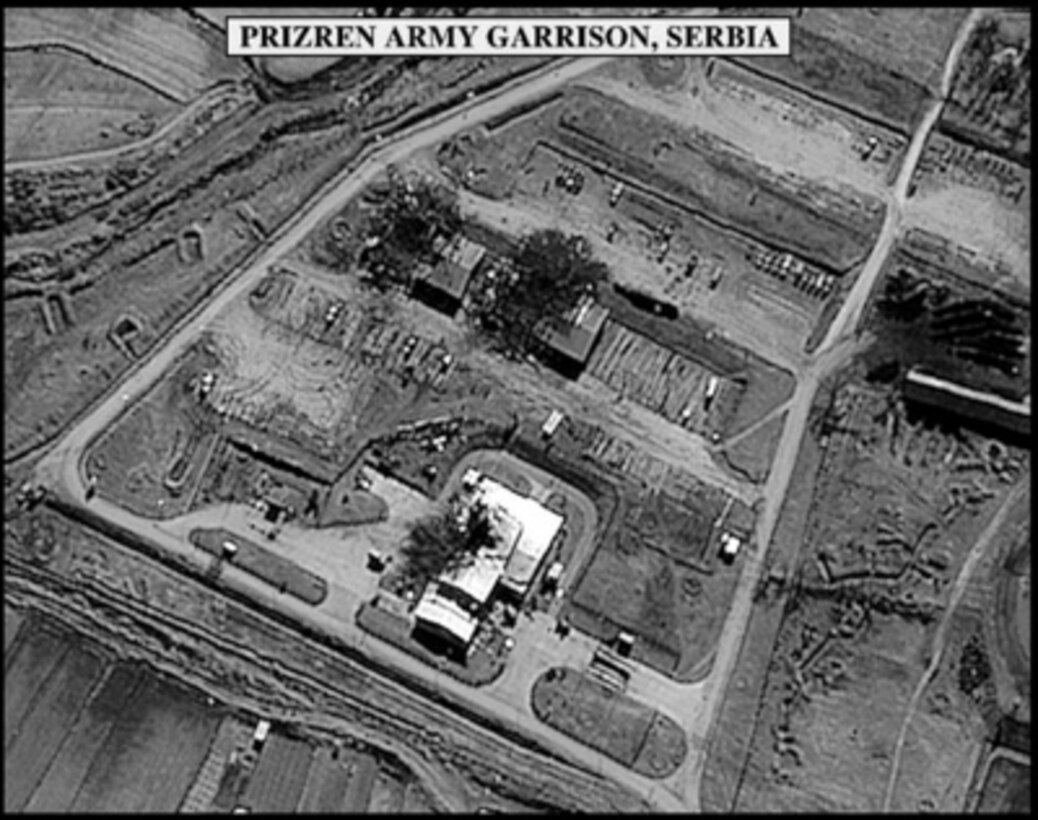 Post-strike bomb damage assessment photograph of damage to buildings in Prizren Army Garrison, Serbia, used by Joint Staff Director of Intelligence Rear Adm. Thomas R. Wilson, U.S. Navy, during a press briefing on NATO Operation Allied Force in the Pentagon on April 7, 1999. 