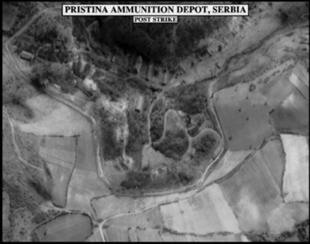 Post-strike bomb damage assessment photograph of the Pristina Ammunition Depot, used by Joint Staff Vice Director for Strategic Plans and Policy Maj. Gen. Charles F. Wald, U.S. Air Force, during a press briefing on NATO Operation Allied Force in the Pentagon on April 9, 1999. 